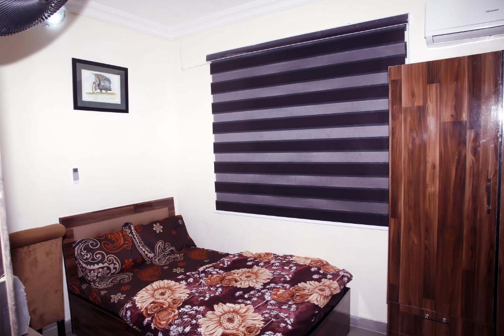 Postel nebo postele na pokoji v ubytování Sunshine Place S4