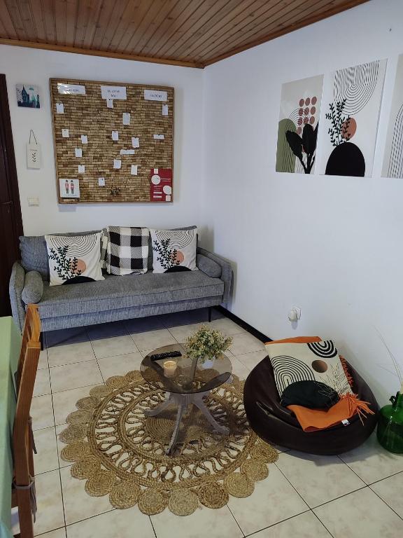 a living room with a couch and a table at Marques House in Machico