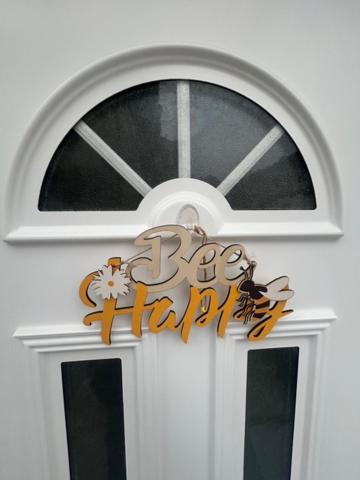 a white door with a clock on top of it at Malpensa Rooms in Case Nuove