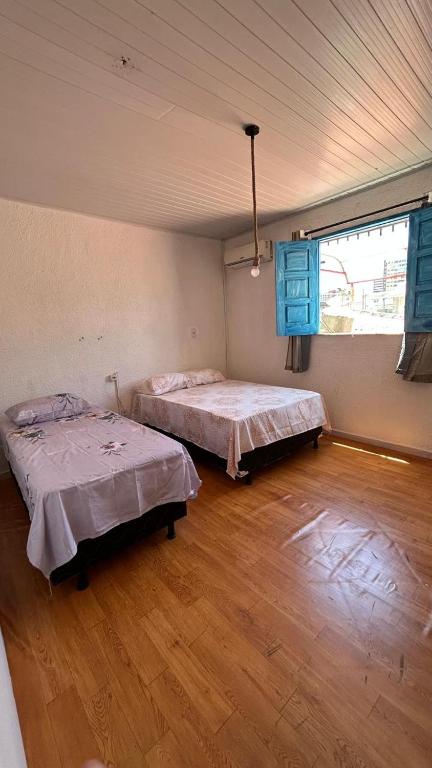 Postel nebo postele na pokoji v ubytování Sequência Surf Paradise HOSTEL E POUSADA
