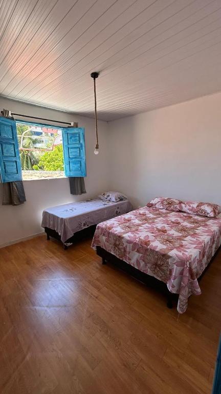 Postel nebo postele na pokoji v ubytování Sequência Surf Paradise HOSTEL E POUSADA