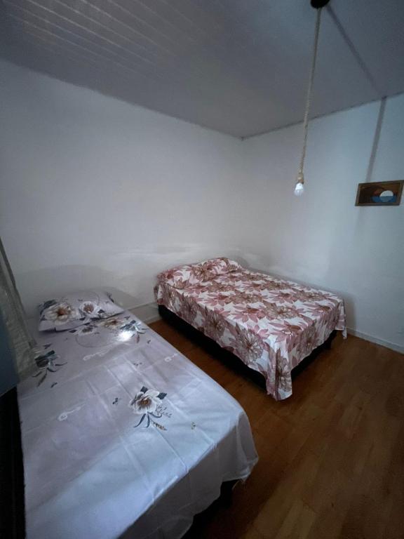 Postel nebo postele na pokoji v ubytování Sequência Surf Paradise HOSTEL E POUSADA