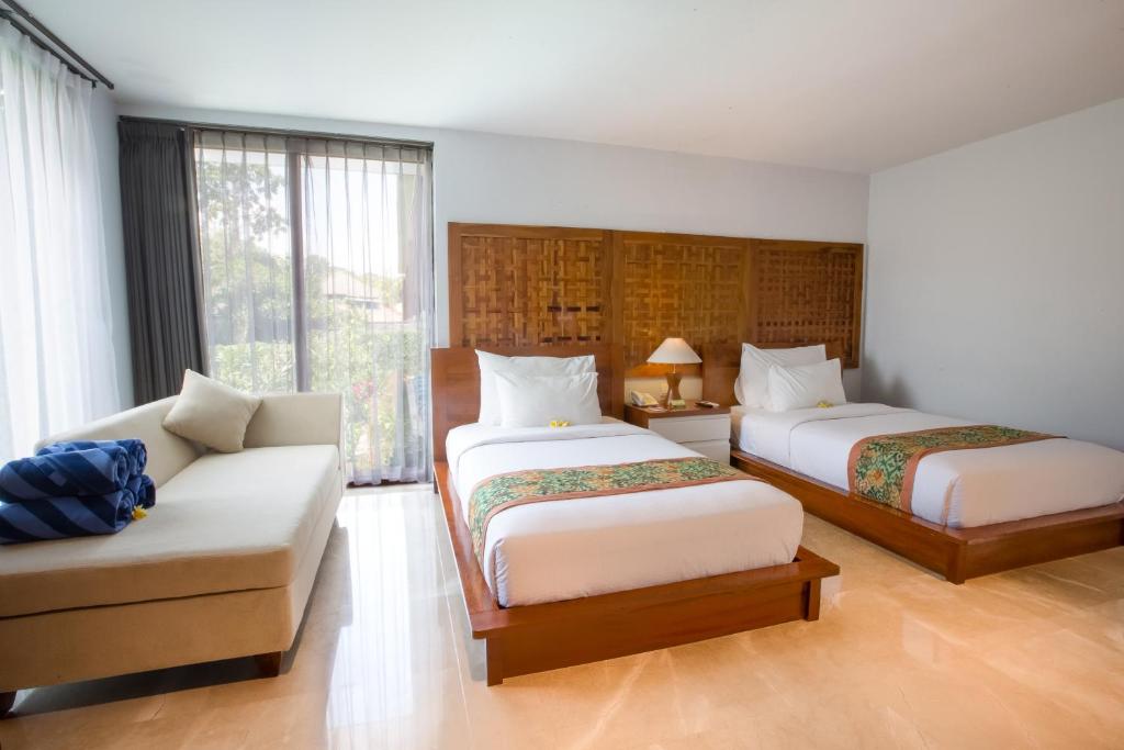 Postel nebo postele na pokoji v ubytování Ubud Wana Resort