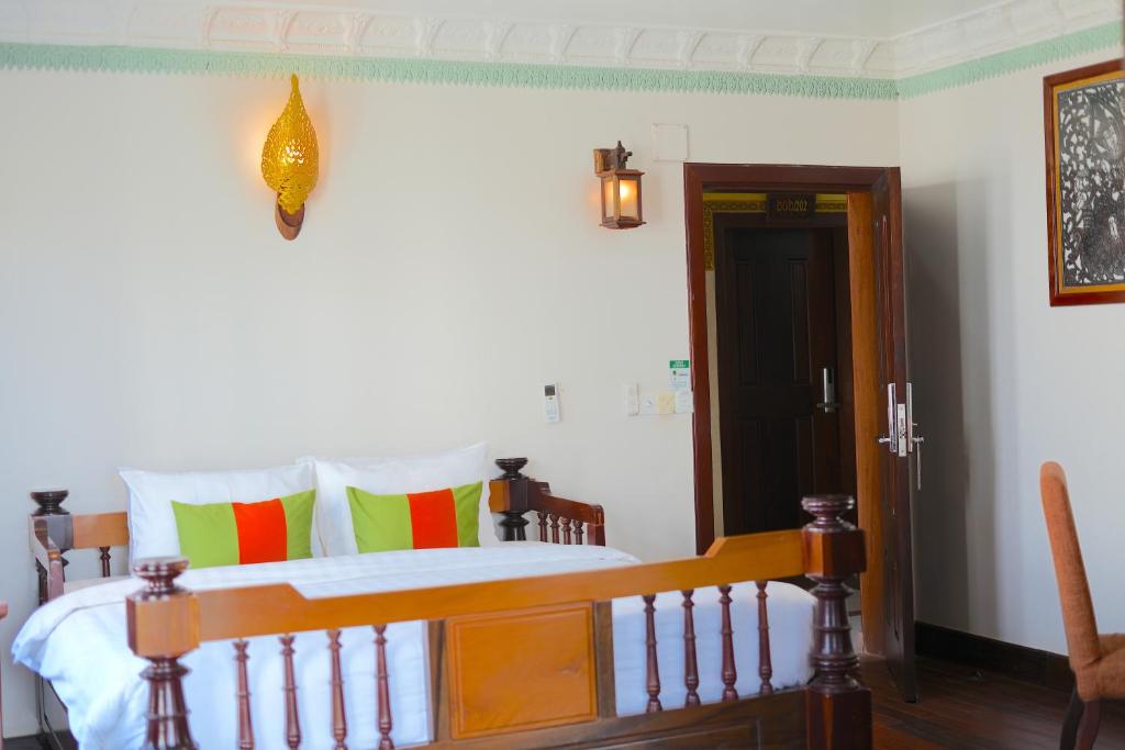 Postel nebo postele na pokoji v ubytování Hello Cambodia Boutique