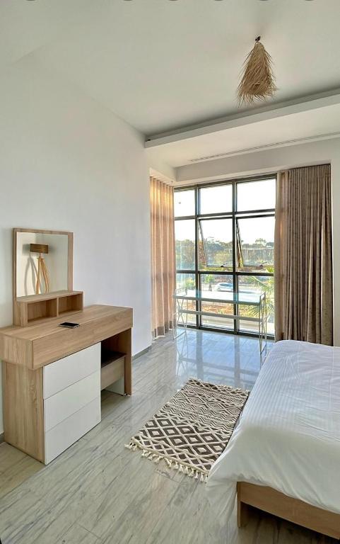 Postel nebo postele na pokoji v ubytování Penthouse Hôtholrie vue mer avec piscine A Gammarth Touristique