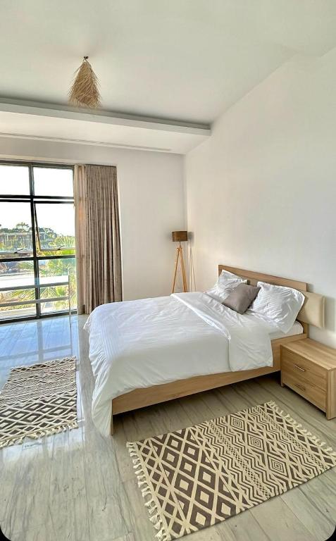 Postel nebo postele na pokoji v ubytování Penthouse Hôtholrie vue mer avec piscine A Gammarth Touristique