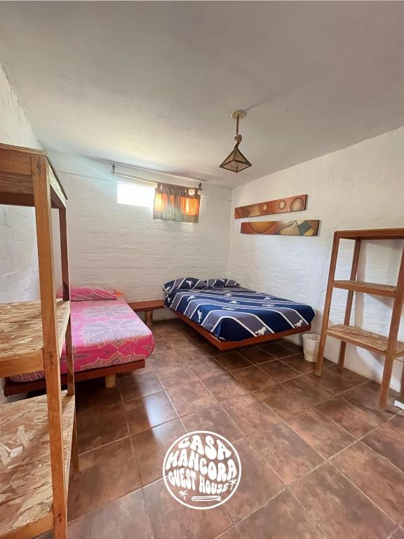 Postel nebo postele na pokoji v ubytování Casa Máncora Guesthouse