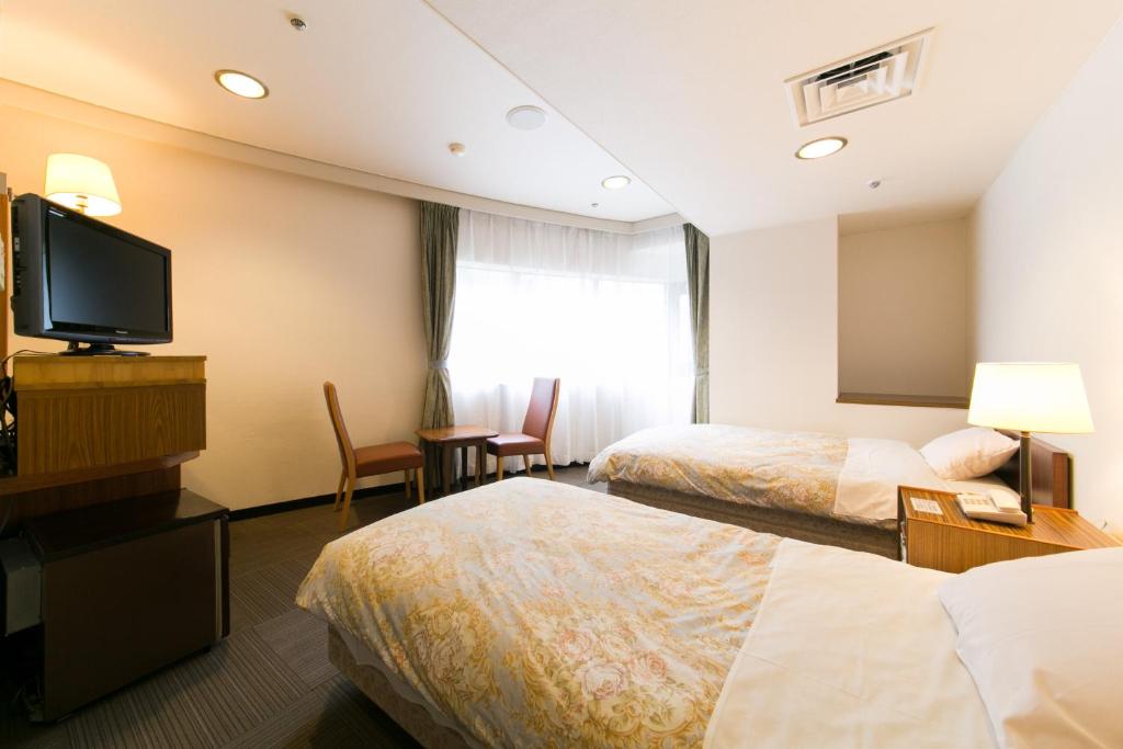 Postel nebo postele na pokoji v ubytování Hotel Ohedo