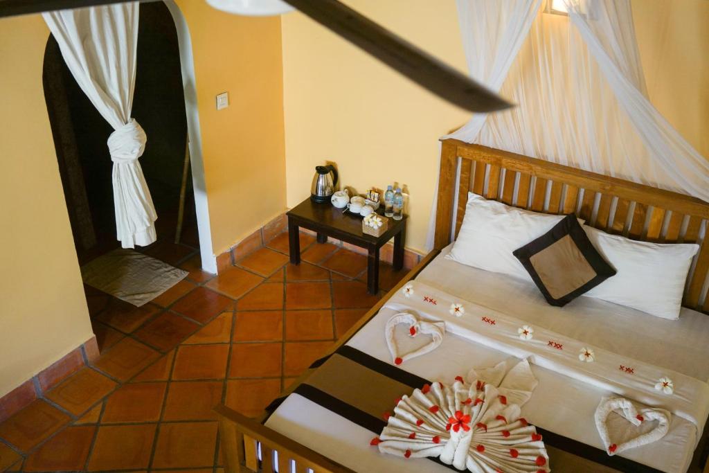 Postel nebo postele na pokoji v ubytování Mealea Resort