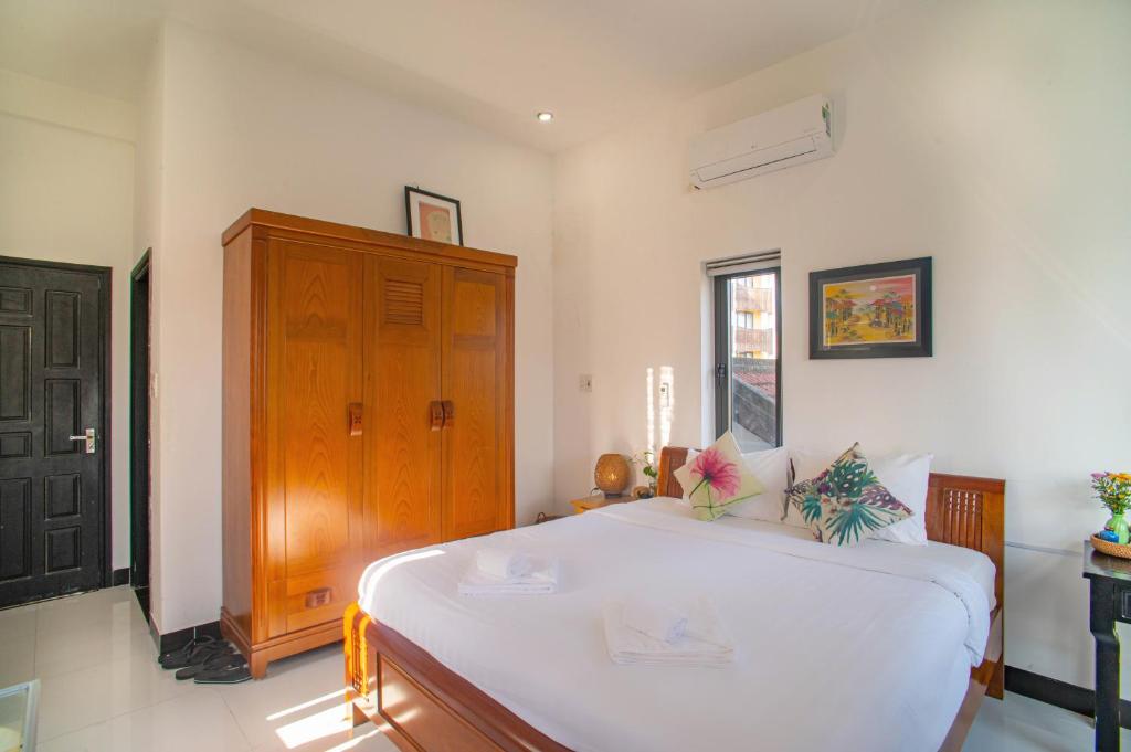 Letto o letti in una camera di Sophia Homestay Hoi An