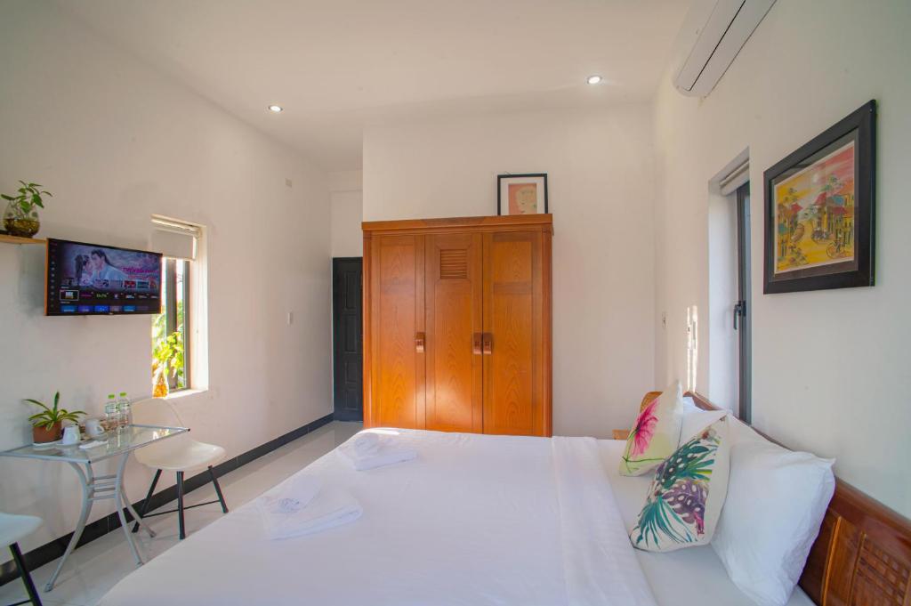 Letto o letti in una camera di Sophia Homestay Hoi An