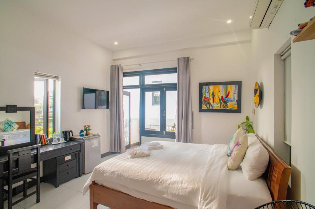 Letto o letti in una camera di Sophia Homestay Hoi An