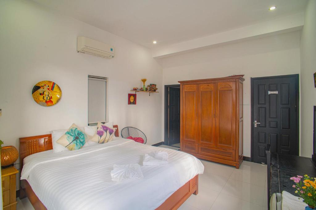 Letto o letti in una camera di Sophia Homestay Hoi An