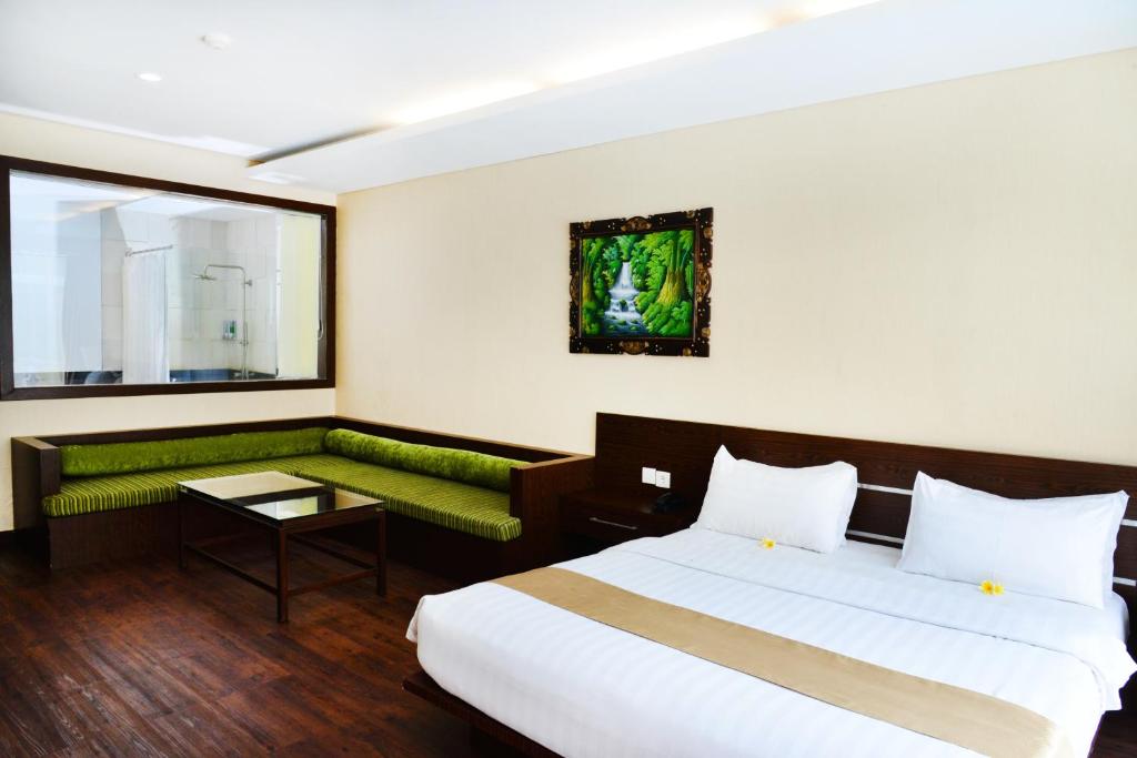 Postel nebo postele na pokoji v ubytování Devata Suites and Residence