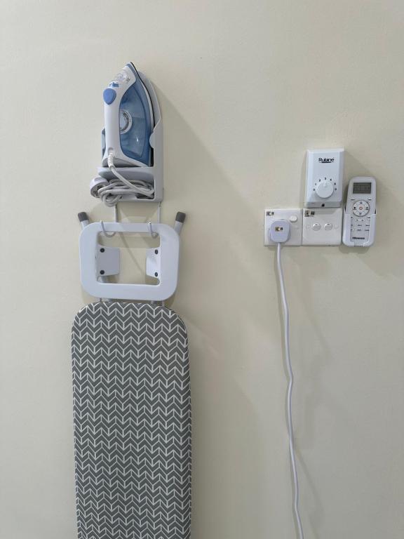 a wall with a video game system on a wall at Teratak Manis Homestay in Kuantan