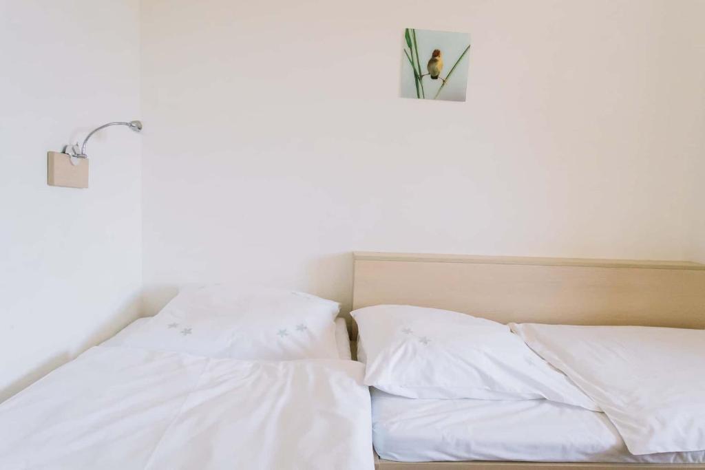 Postel nebo postele na pokoji v ubytování Diófa Apartman
