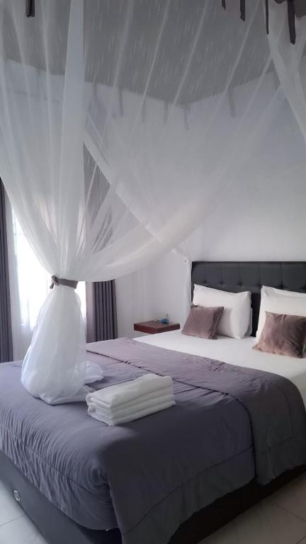 Postel nebo postele na pokoji v ubytování Guest House d Valeri