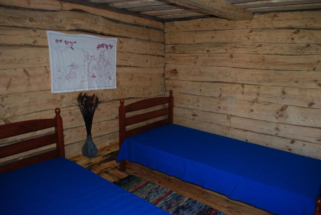Postel nebo postele na pokoji v ubytování Hallikivi Tourist Farm
