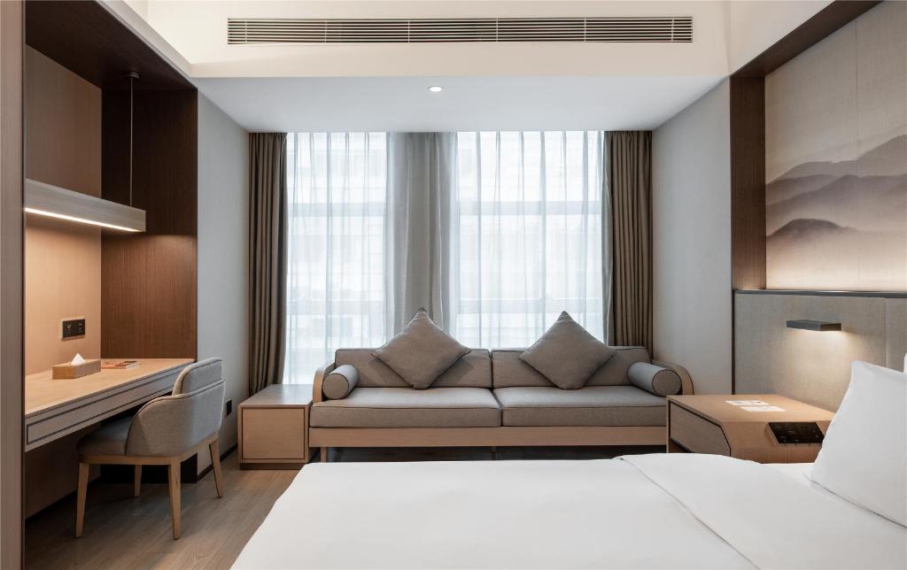 Katil atau katil-katil dalam bilik di JOYA Hotel Chengdu High Technology