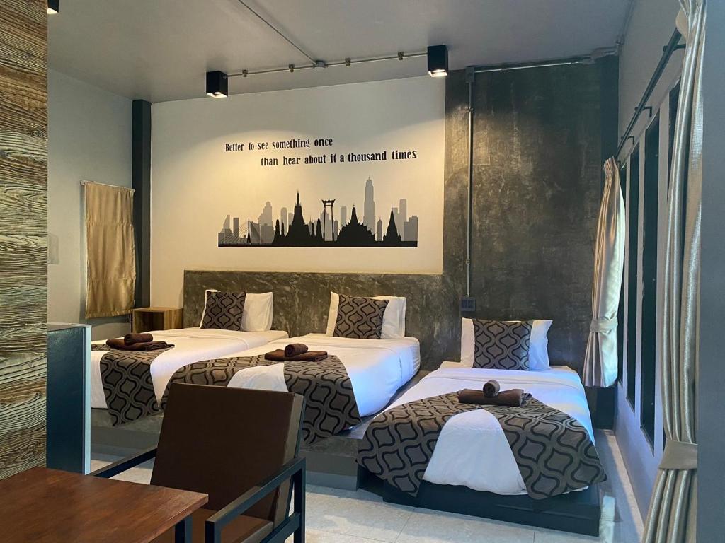 Postel nebo postele na pokoji v ubytování Midtown Sukhothai