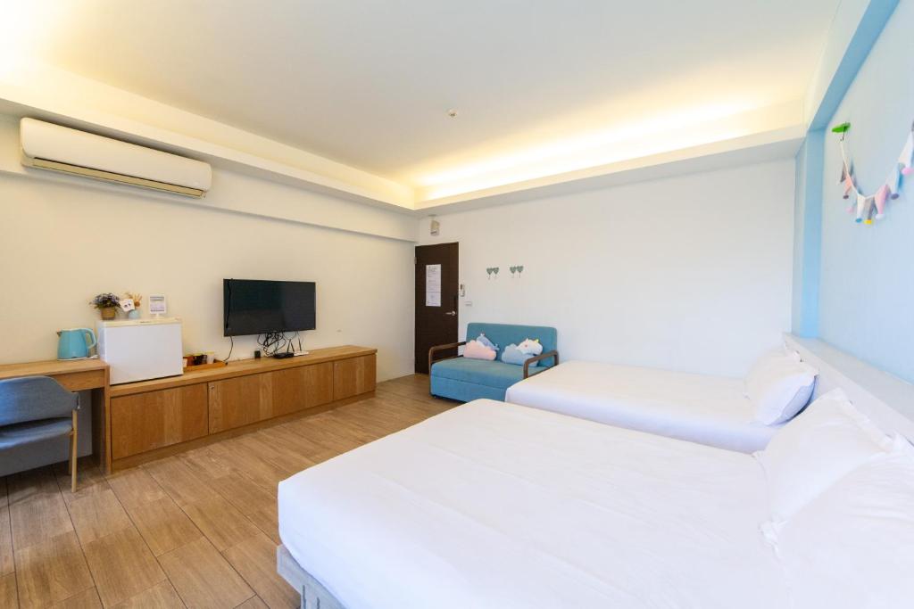 Postel nebo postele na pokoji v ubytování Ting Shuan B B&B