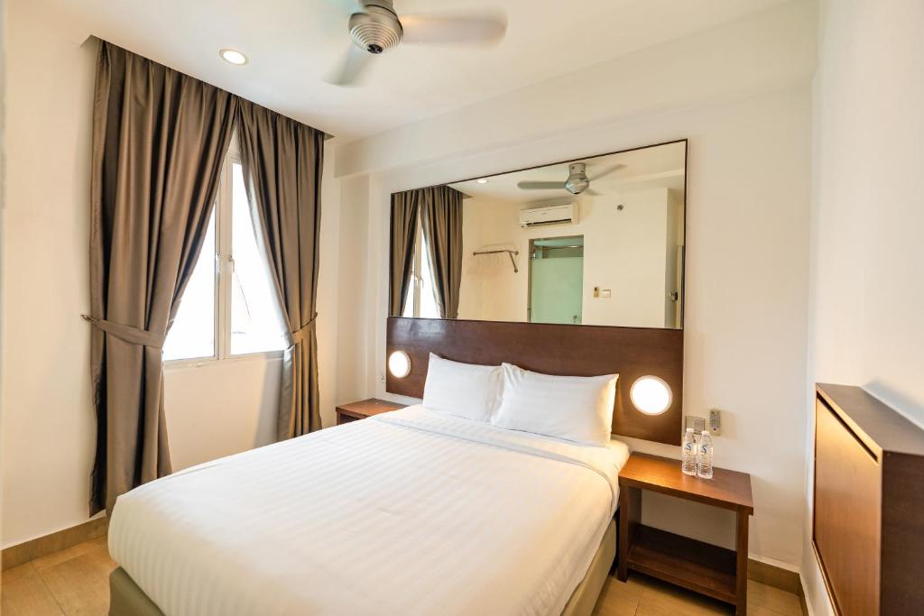 Postel nebo postele na pokoji v ubytování Tune Hotel Georgetown Penang