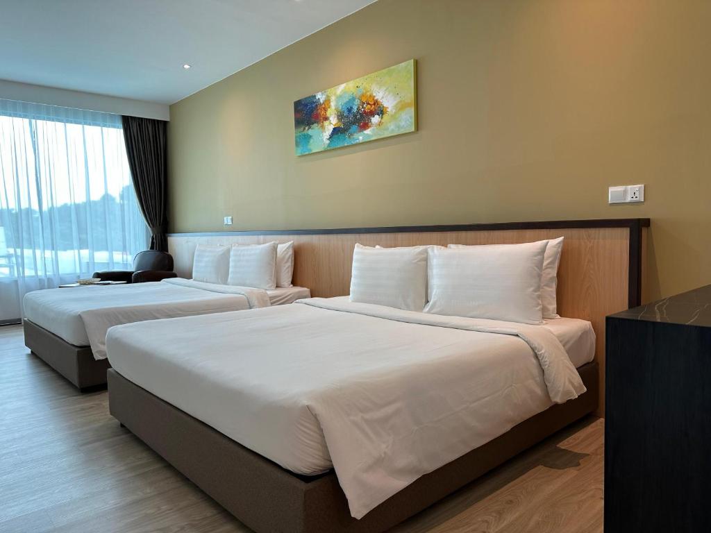 Postel nebo postele na pokoji v ubytování Hotel 7 Suria