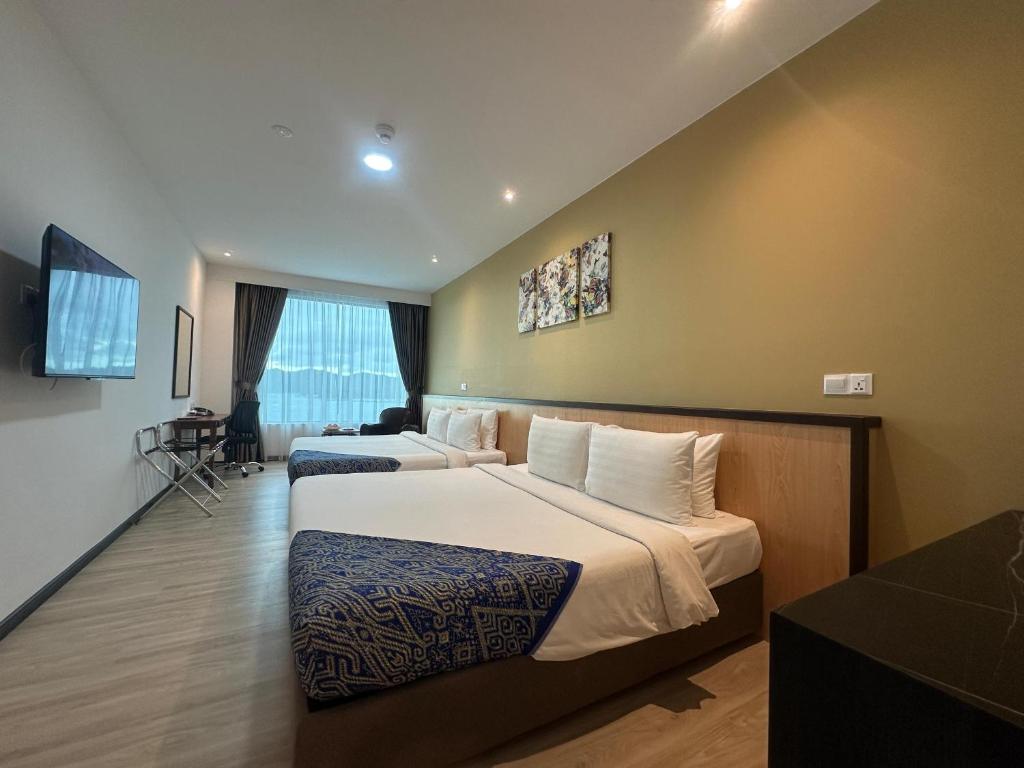 Postel nebo postele na pokoji v ubytování Hotel 7 Suria