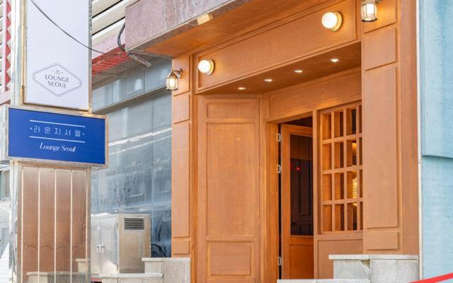 a entrance to a store with a blue sign on it at Lounge Seoul in Icheon