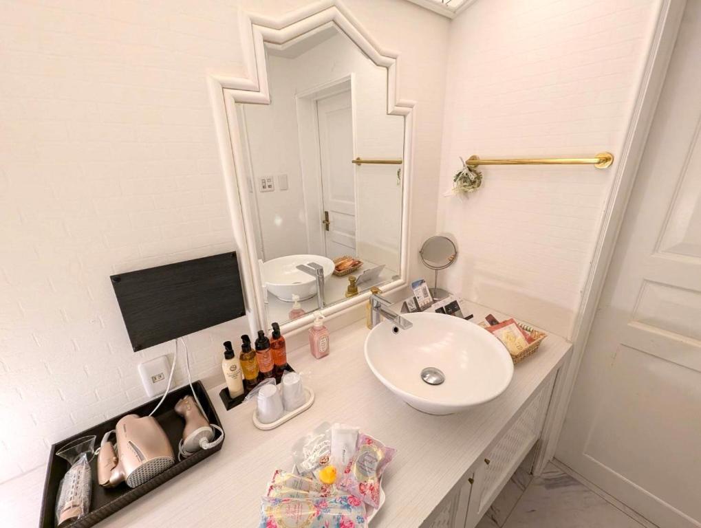 TV a/nebo společenská místnost v ubytování Hotel First (Adult Only)