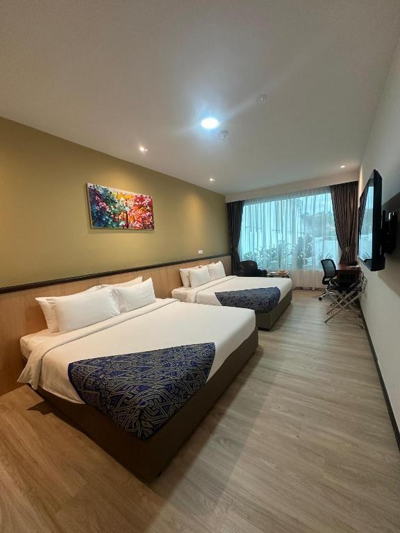Postel nebo postele na pokoji v ubytování Hotel 7 Suria