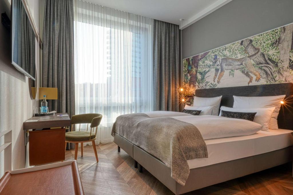 Postel nebo postele na pokoji v ubytování Vienna House Easy by Wyndham Hamburg Bergedorf