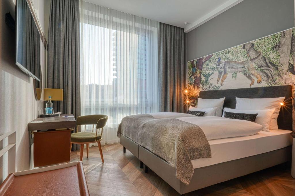 Postel nebo postele na pokoji v ubytování Vienna House Easy by Wyndham Hamburg Bergedorf