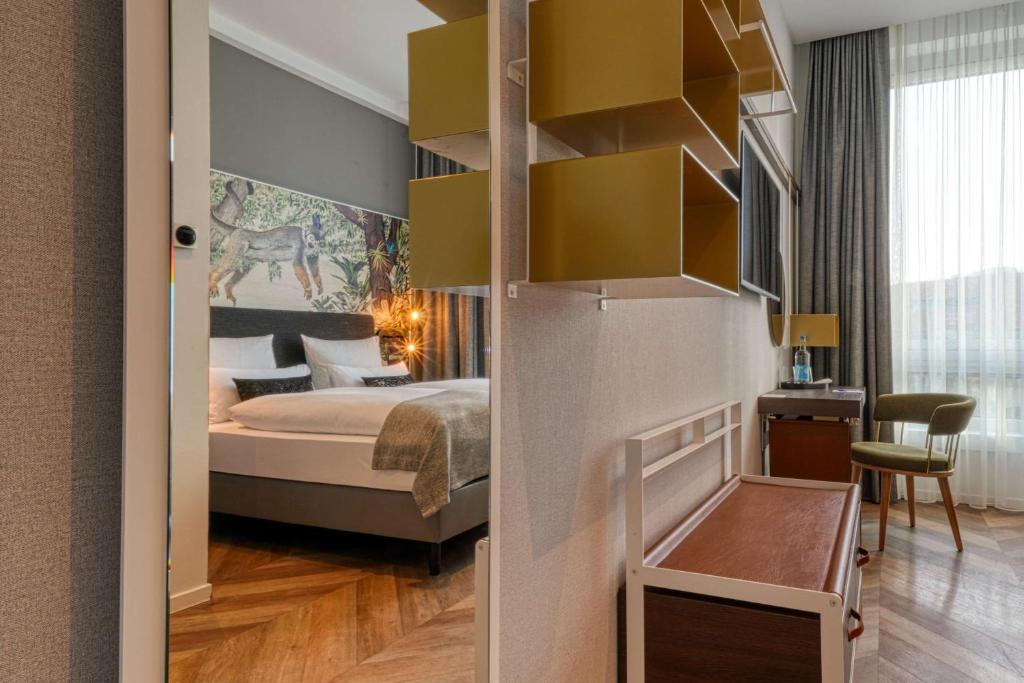 Postel nebo postele na pokoji v ubytování Vienna House Easy by Wyndham Hamburg Bergedorf