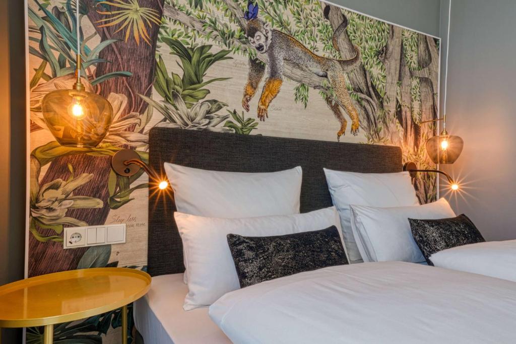 Postel nebo postele na pokoji v ubytování Vienna House Easy by Wyndham Hamburg Bergedorf