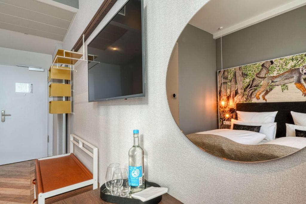 Postel nebo postele na pokoji v ubytování Vienna House Easy by Wyndham Hamburg Bergedorf
