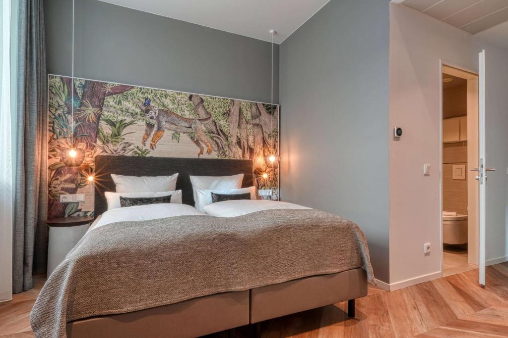 Postel nebo postele na pokoji v ubytování Vienna House Easy by Wyndham Hamburg Bergedorf