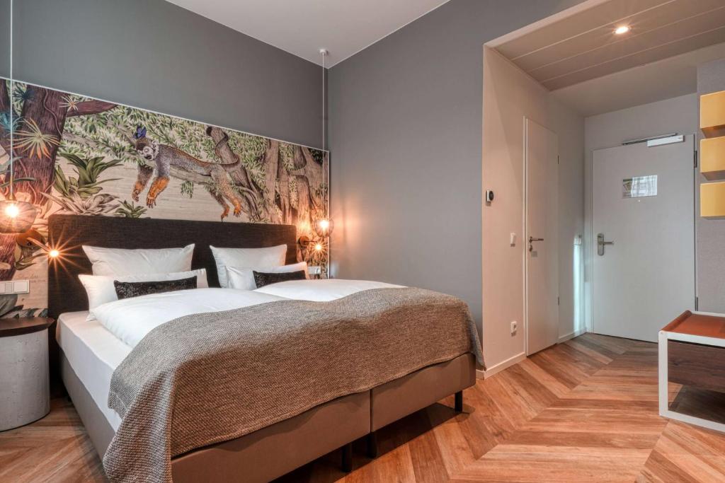 Postel nebo postele na pokoji v ubytování Vienna House Easy by Wyndham Hamburg Bergedorf