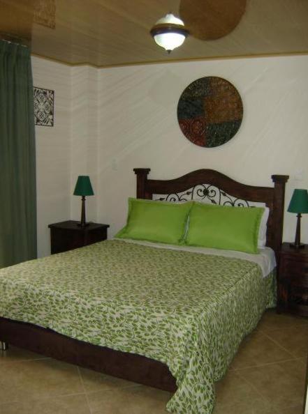 Postel nebo postele na pokoji v ubytování Hoteles Bogotá Inn La Soledad