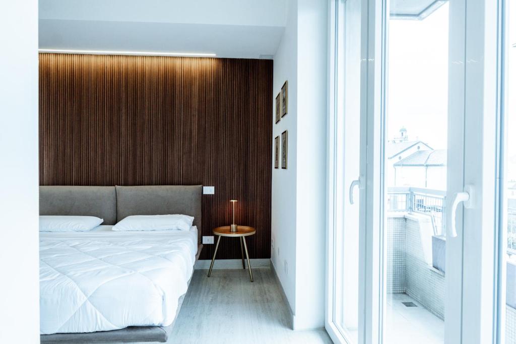 Postel nebo postele na pokoji v ubytování Ram7 Lux Charmant Apartment Gallarate
