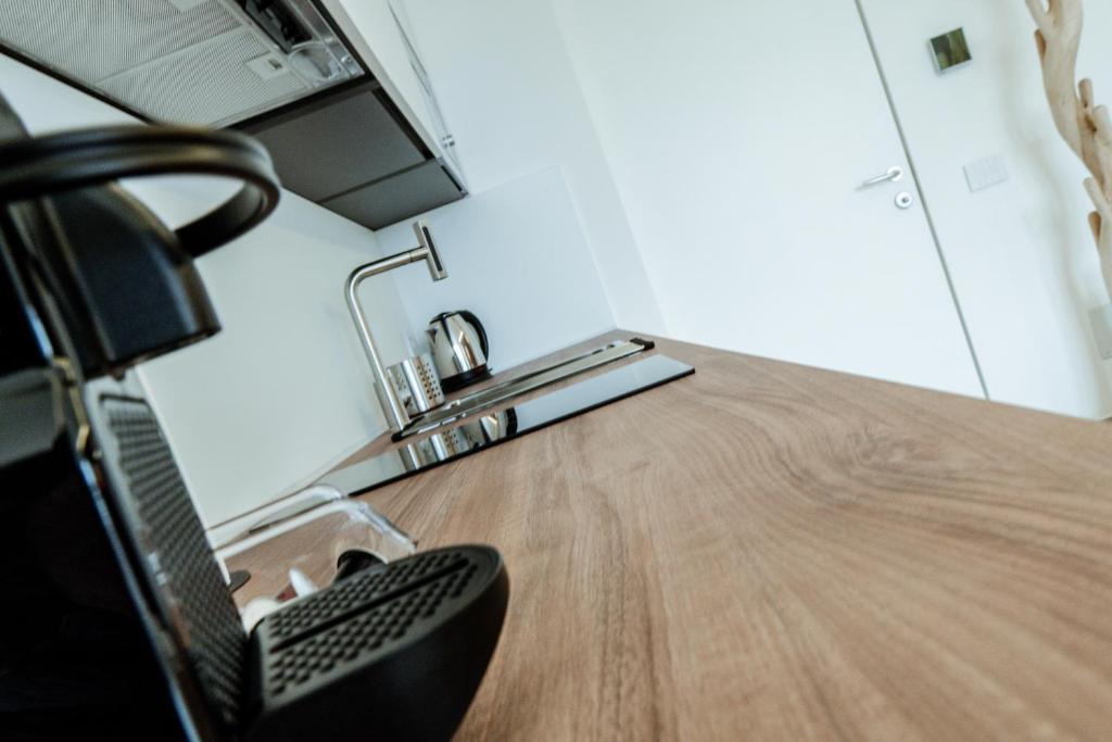 Kuchyň nebo kuchyňský kout v ubytování Ram7 Lux Charmant Apartment Gallarate
