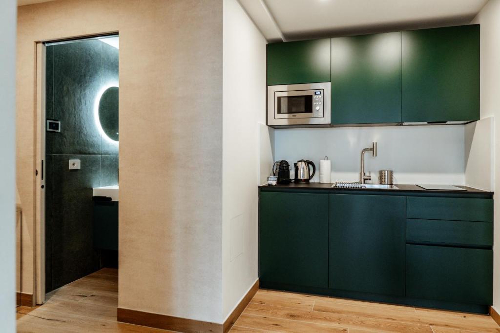 Kuchyň nebo kuchyňský kout v ubytování Ram7 Segredo Ultrassecreto Apartment Gallarate
