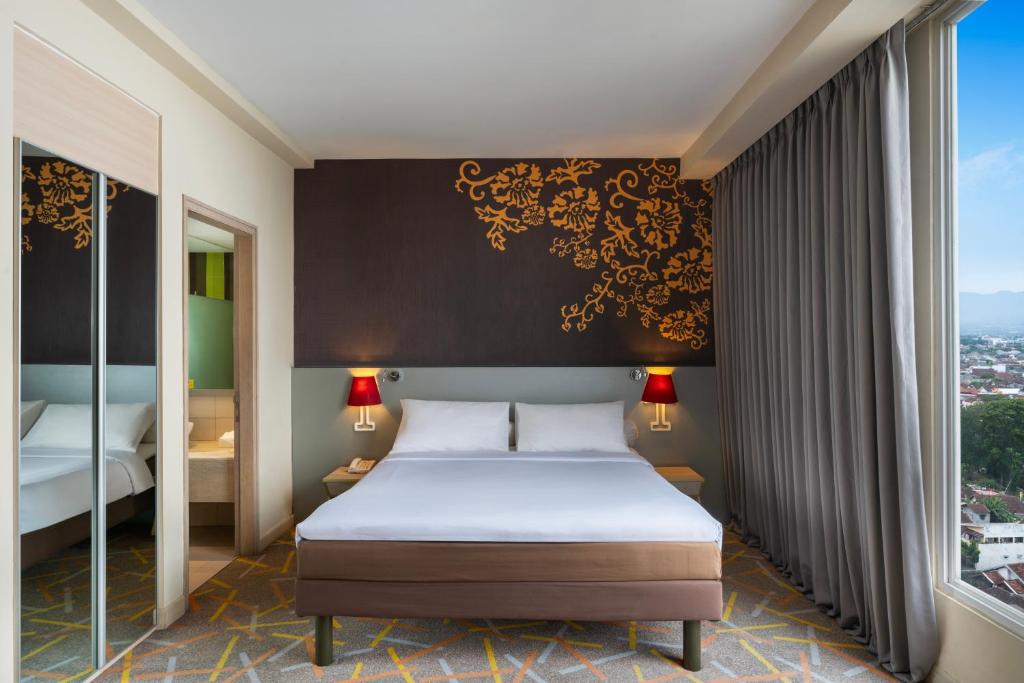 Voodi või voodid majutusasutuse Ibis Styles Malang toas