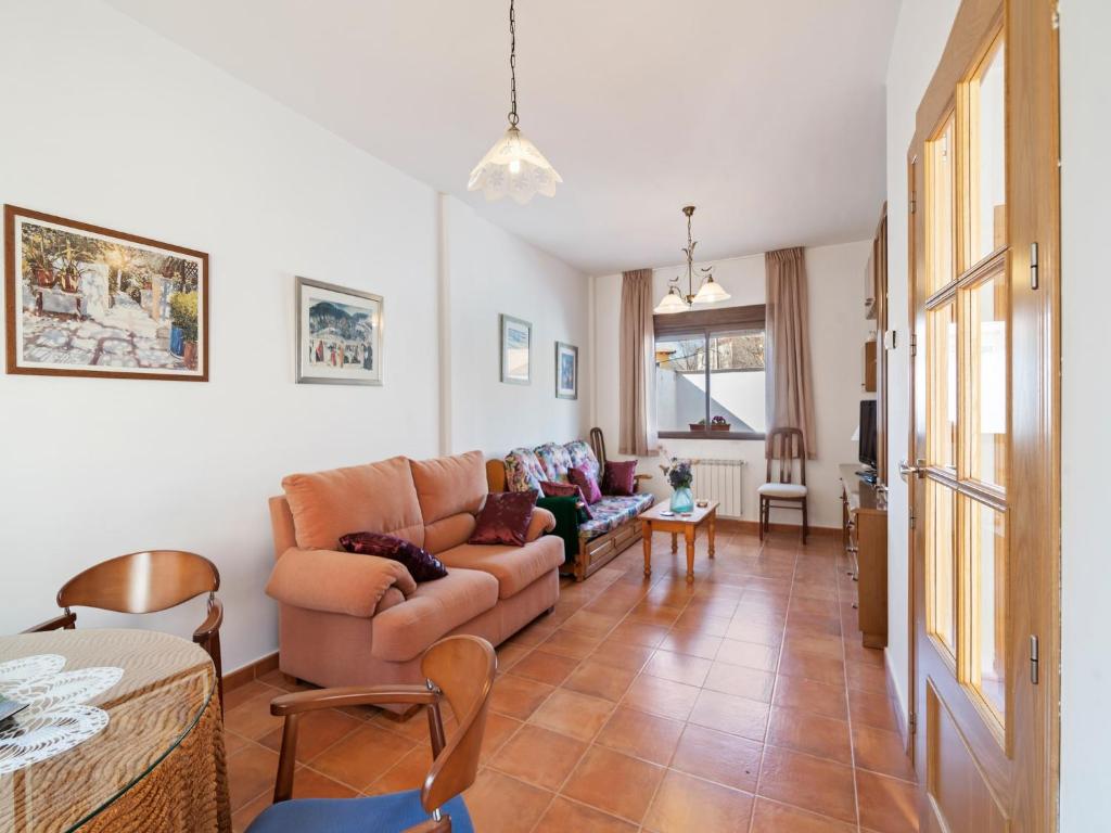 a living room with a couch and a table at Casa Rural La Bienservida in Bienservida
