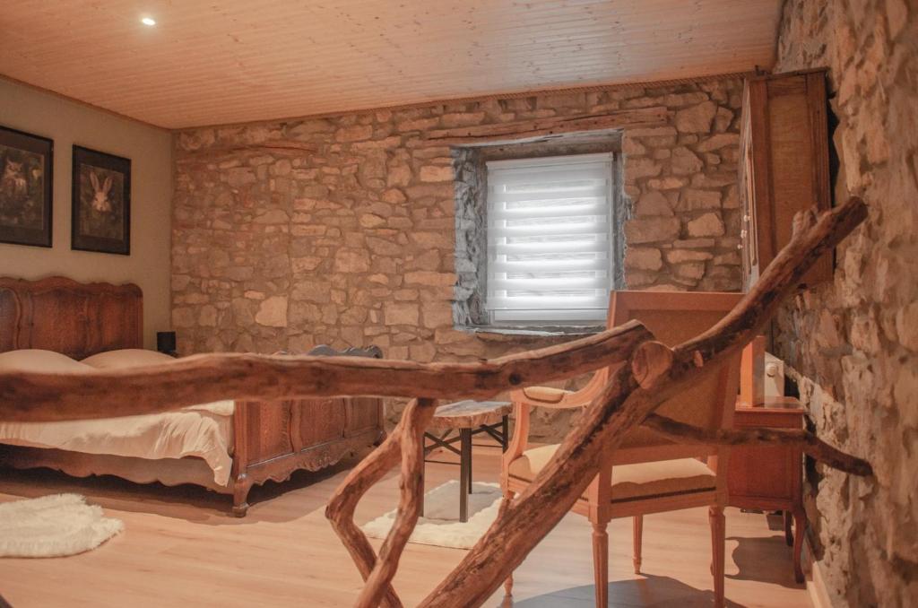 Postel nebo postele na pokoji v ubytování Au loupus