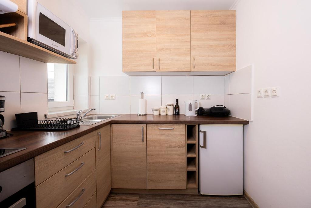 Kuchyň nebo kuchyňský kout v ubytování Grom Ribno Apartments