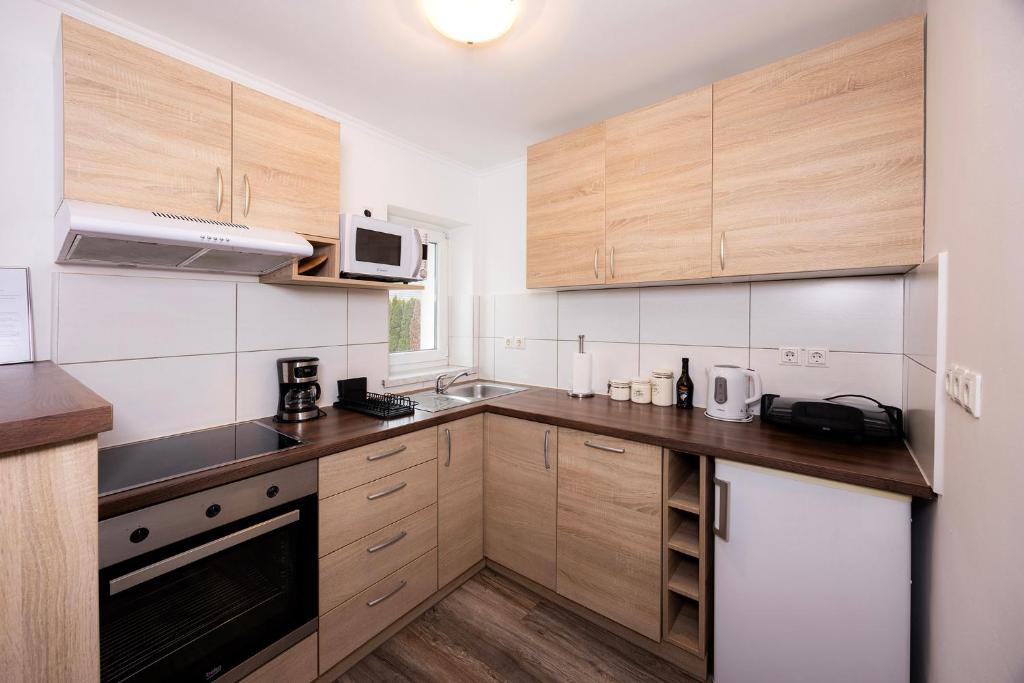 Kuchyň nebo kuchyňský kout v ubytování Grom Ribno Apartments