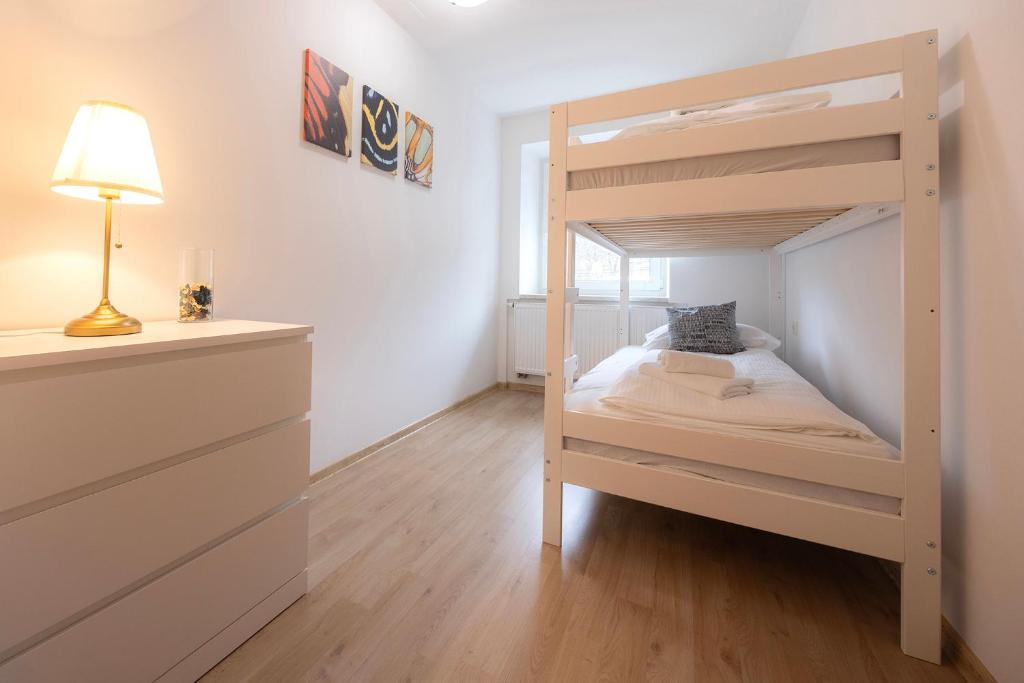 Postel nebo postele na pokoji v ubytování Grom Ribno Apartments
