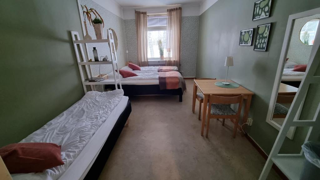 Postel nebo postele na pokoji v ubytování Piteå Vandrarhem