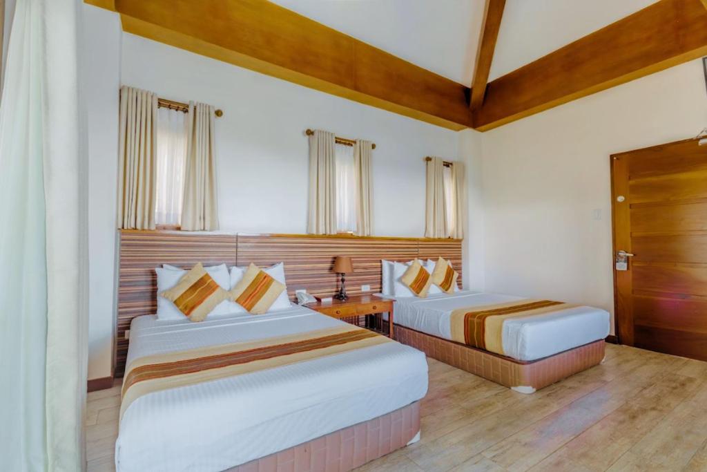 Postel nebo postele na pokoji v ubytování Mist Mountain Resort powered by Cocotel